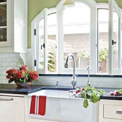 farmhouse sink in this remodeled spanish style kitchen