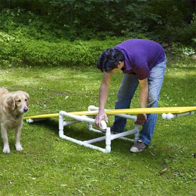 connecting the crosspiece and the teeter-totter plank