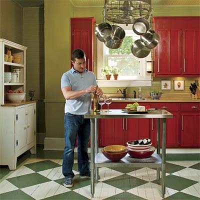 bungalow's kitchen after renovation with repainted wood cabinets
