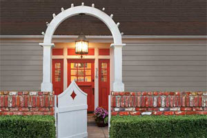 highly styled entry way with red painted door