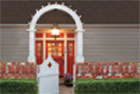 highly styled entry way with red painted door