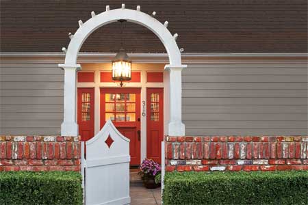 highly styled entry way with red painted door