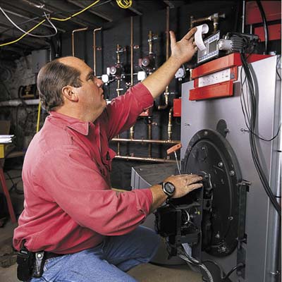 man plumbing forced air heating system