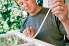 toh host kevin o'connor repairing the weatherstripping in a wood window
