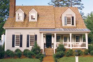 cape cod style house showing wood windows incorporated into the architecture