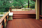 Large deck with burgundy-tinted stain