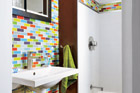 small bathroom with colorful glass tiles