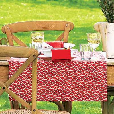 outdoor dining table with colorful runners