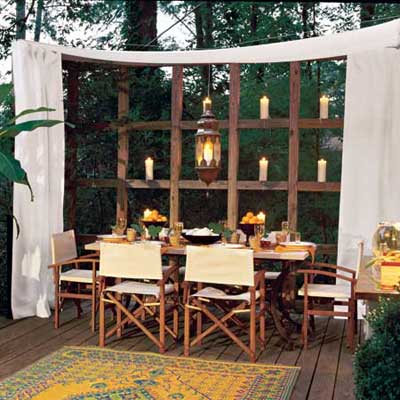 outdoor dining table in curtained alcove