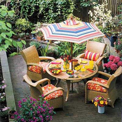 outdoor table under striped umbrella