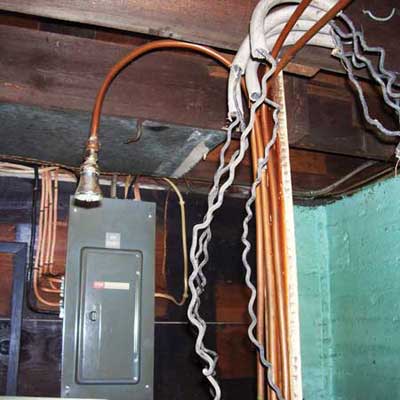 showerhead in front of a circuit panel box