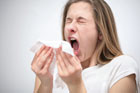 woman sneezing