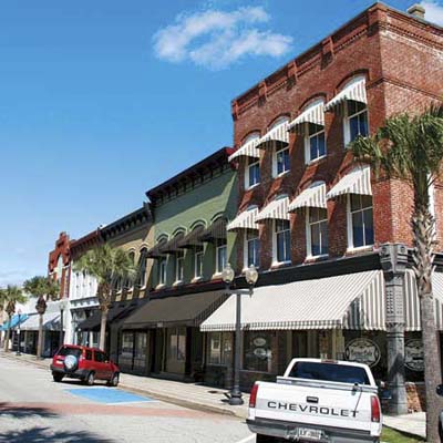 row of main street shops and residencies in georgia's best old house neighborhood