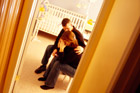 unhappy couple sitting in baby's room