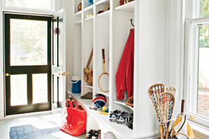mudroom entryway with runner and shelf storage