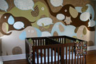 nursery with crib and elephant mural