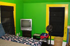 ugly bedroom with florescent green and yellow walls