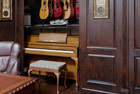 home office with hidden hobby room for music storage