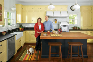 couple and dog together in their newly remodeled vintage look kitchen