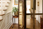 forged brass entry set in wood and glass interior door