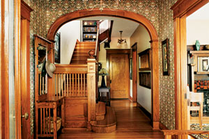 front entry archway and stairs of beautiful remodel