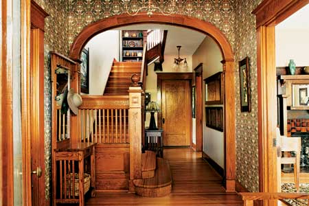 front entry archway and stairs of beautiful remodel
