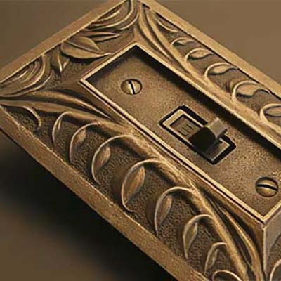 a switch plate with switch attached but not installed in a wall