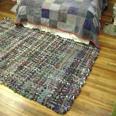 rug on a hardwood bedroom floor