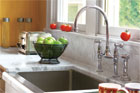traditional bridge kitchen faucet with white marble counters