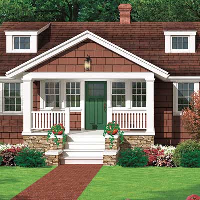 cottage with dormer windows and brick path