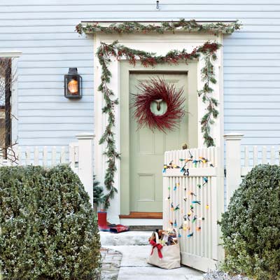 retro style holiday lights strung to an entry gate