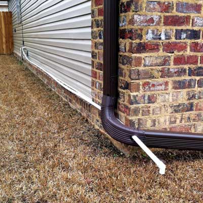 Gutter downspout with long drain hose