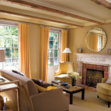 living room with fireplace in this whaling cottage remodel