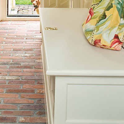 mudroom with a flip-top bench