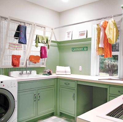 bright and spacious laundry room with storage
