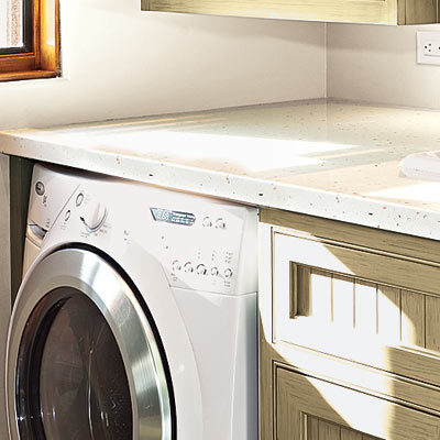 high efficiency laundry room with low care counter