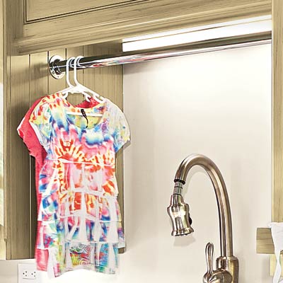 high efficiency laundry room with over the sink rod