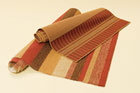 a pair of outdoor rugs, high-end and budget