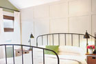 The Malinek's remodeled master bedroom with paneled wall