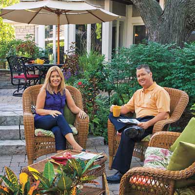 man and woman sitting on outdoor patio