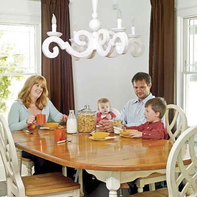 Homeowners Jennifer and Jeff Kuryluk with daughter and son at kitchen table