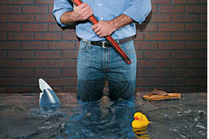 man standing in flooded basement