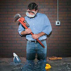 man standing in flooded basement
