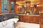 Craftsman style bathroom makeover with clerestory casement windows and oak cabinets