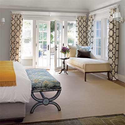 the master bedroom in this remodeled, light-filled colonial home