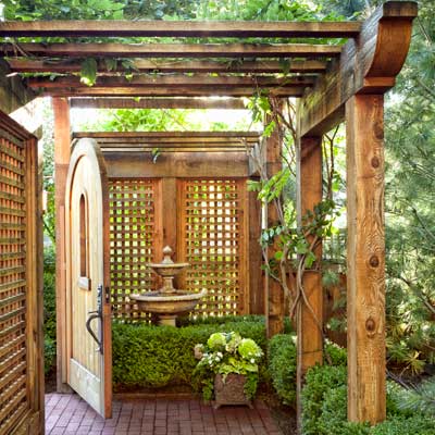 arched wood garden gate brick path 