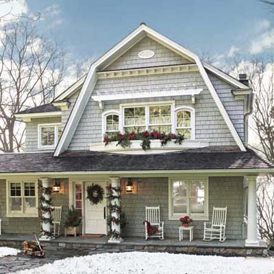 shingle-style cottage exterior decorated for Christmas
