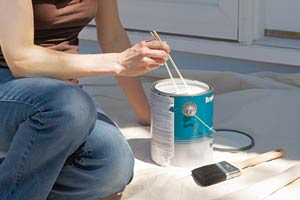 Homeowner uses chopsticks to mix paint