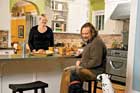 couple and their dogs inside their newly remodeled kitchen
