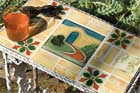 small outdoor table with top made of vintage tile